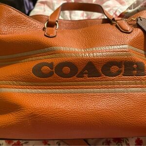 Coach Vibrant Orange Leather Travel Bag Looking for the matching wallet only.